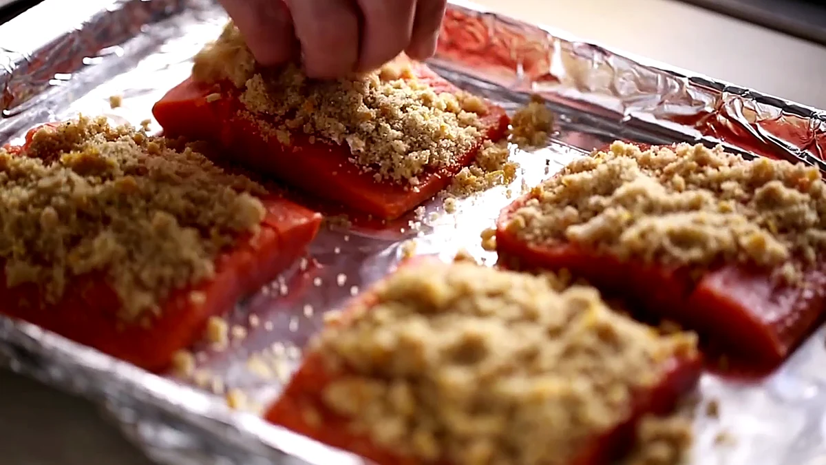 Brown sugar topping pressed onto salmon fillets