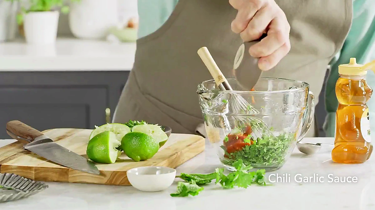 Chili garlic sauce added to lime and herbs