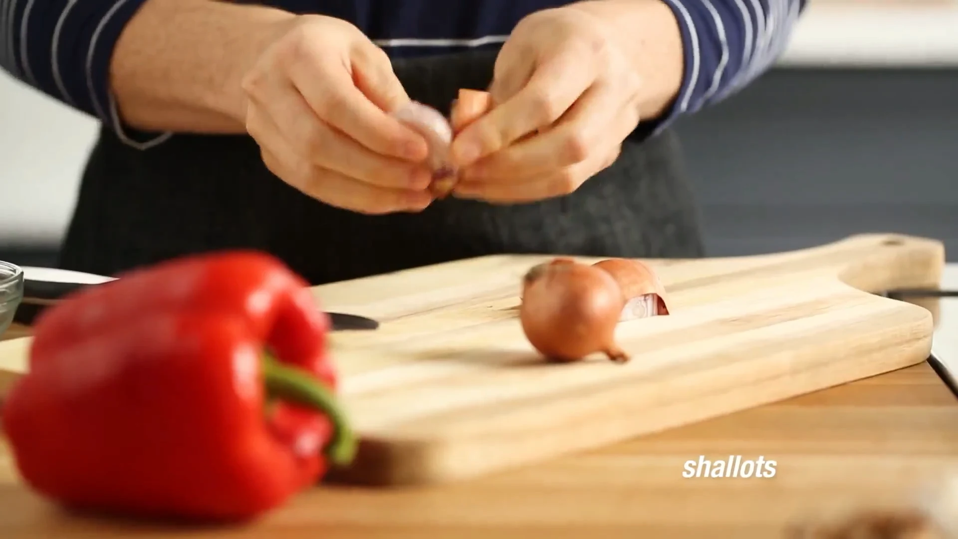 Shallots on a cutting board ready to be sliced