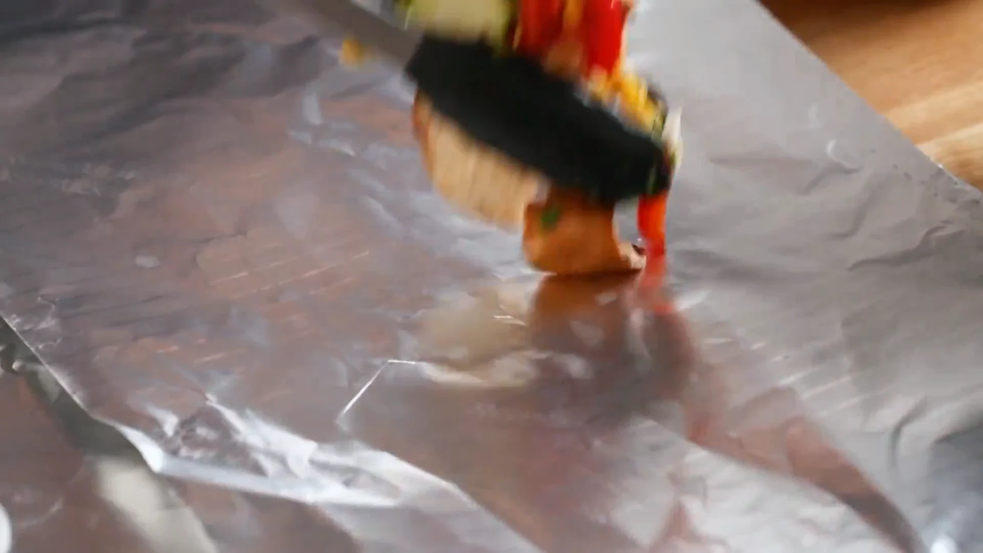 Seasoned vegetables placed on a sheet of foil