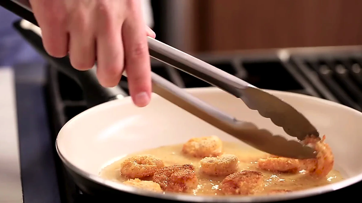 Shrimp frying until the coating turns golden