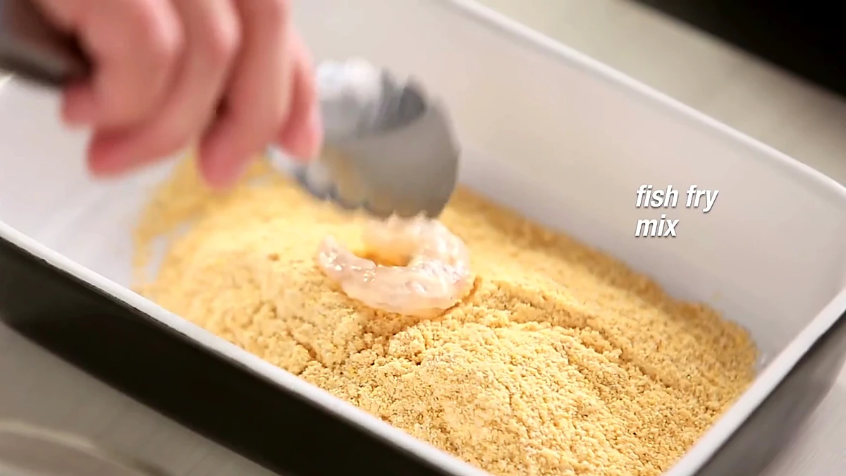 Shrimp placed into fish fry mix