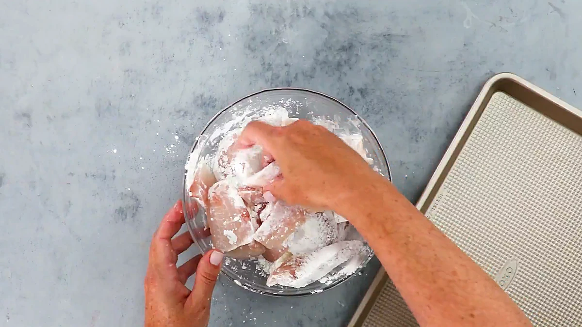 Tilapia pieces coated in a thick white batter