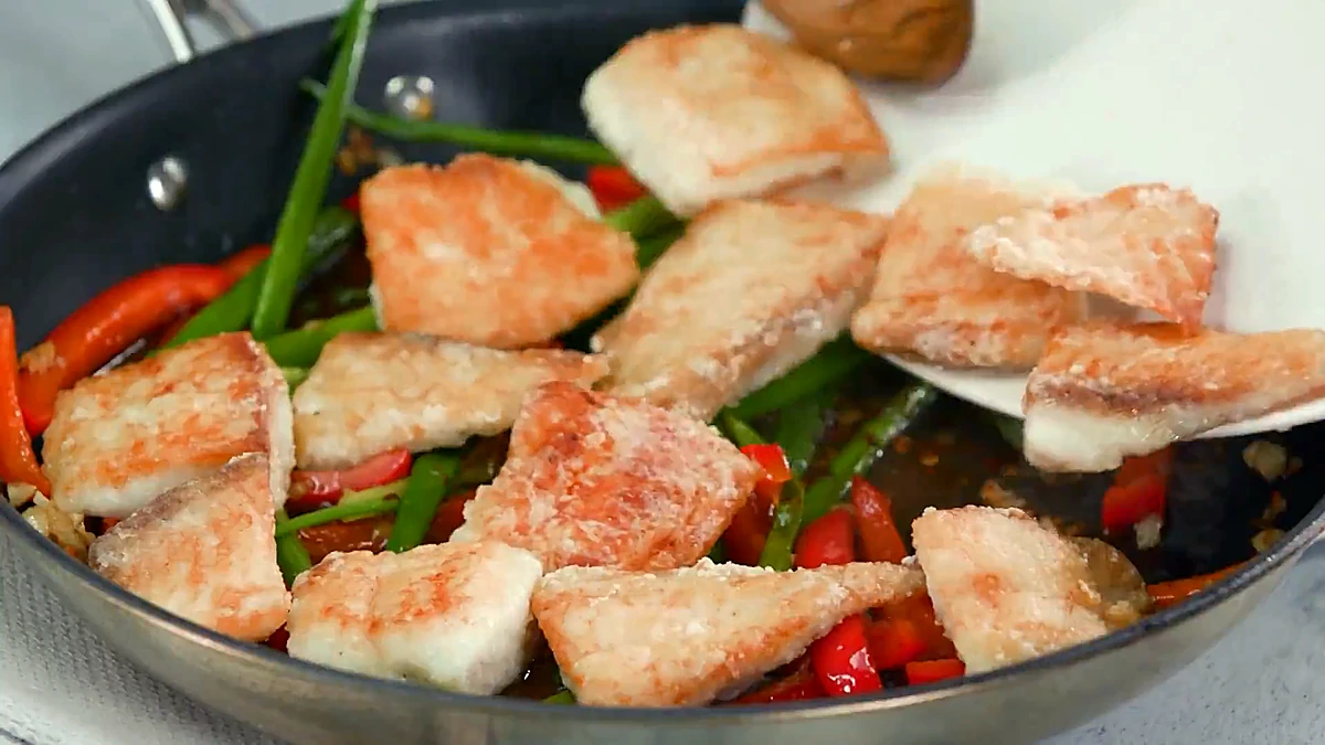 Crispy fish tossed back into the sauce