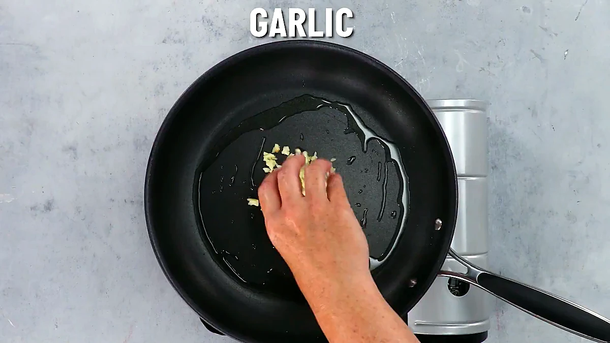 Chopped garlic cooking in the pan