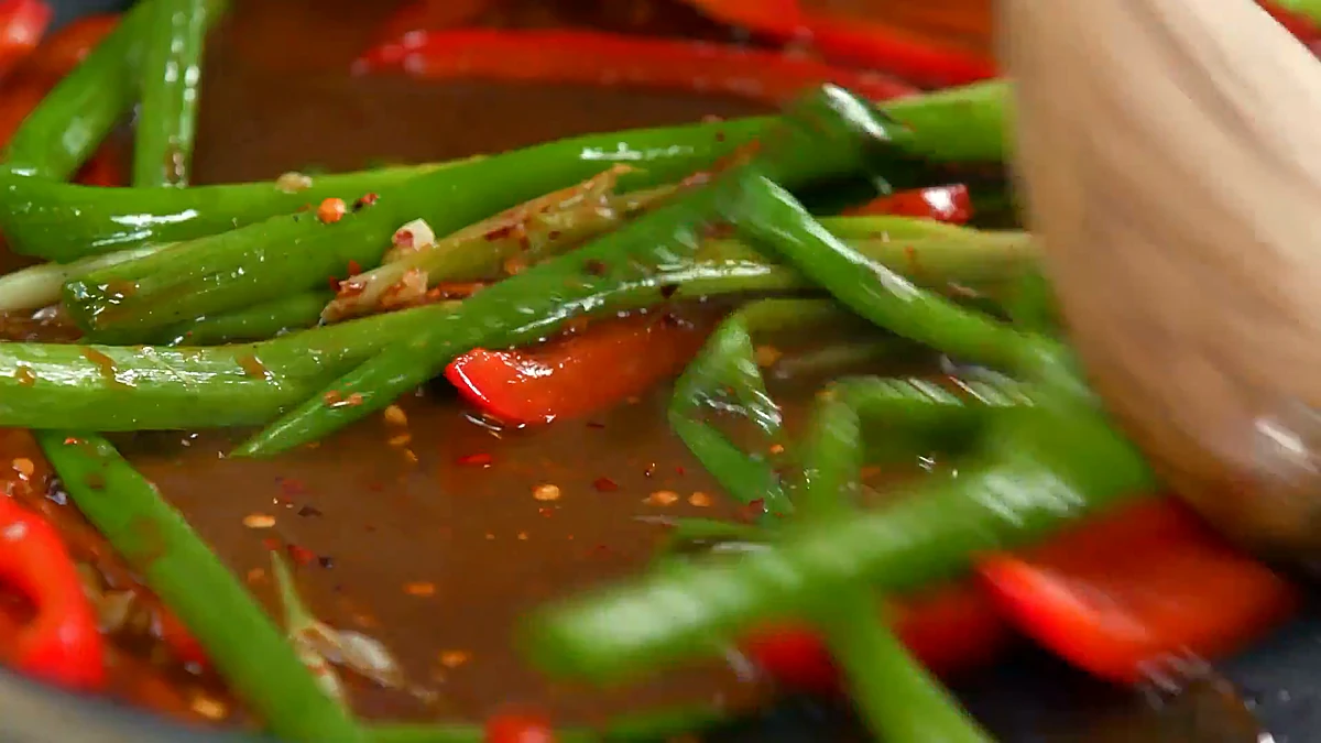 Soy sherry sauce poured over the scallions and peppers