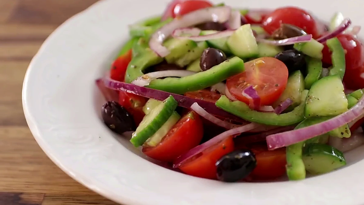 Greek salad plated before feta