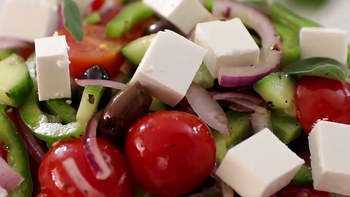 Close view of Greek salad with feta and tomatoes