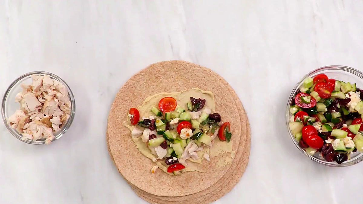 Overhead view of Greek chicken wrap before rolling
