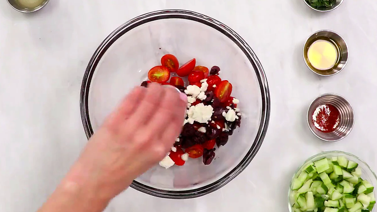 Feta cheese added to Greek wrap filling