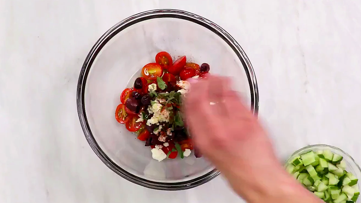 Ground red pepper added to the bowl