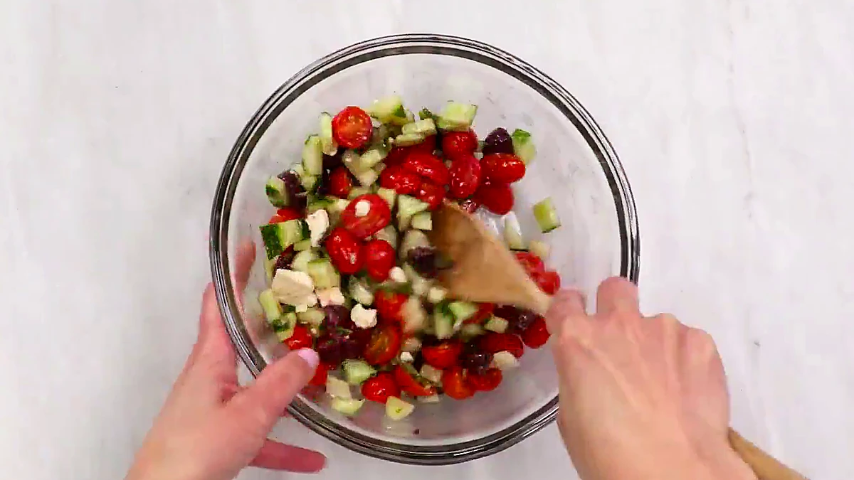 Greek salad filling tossed in a bowl