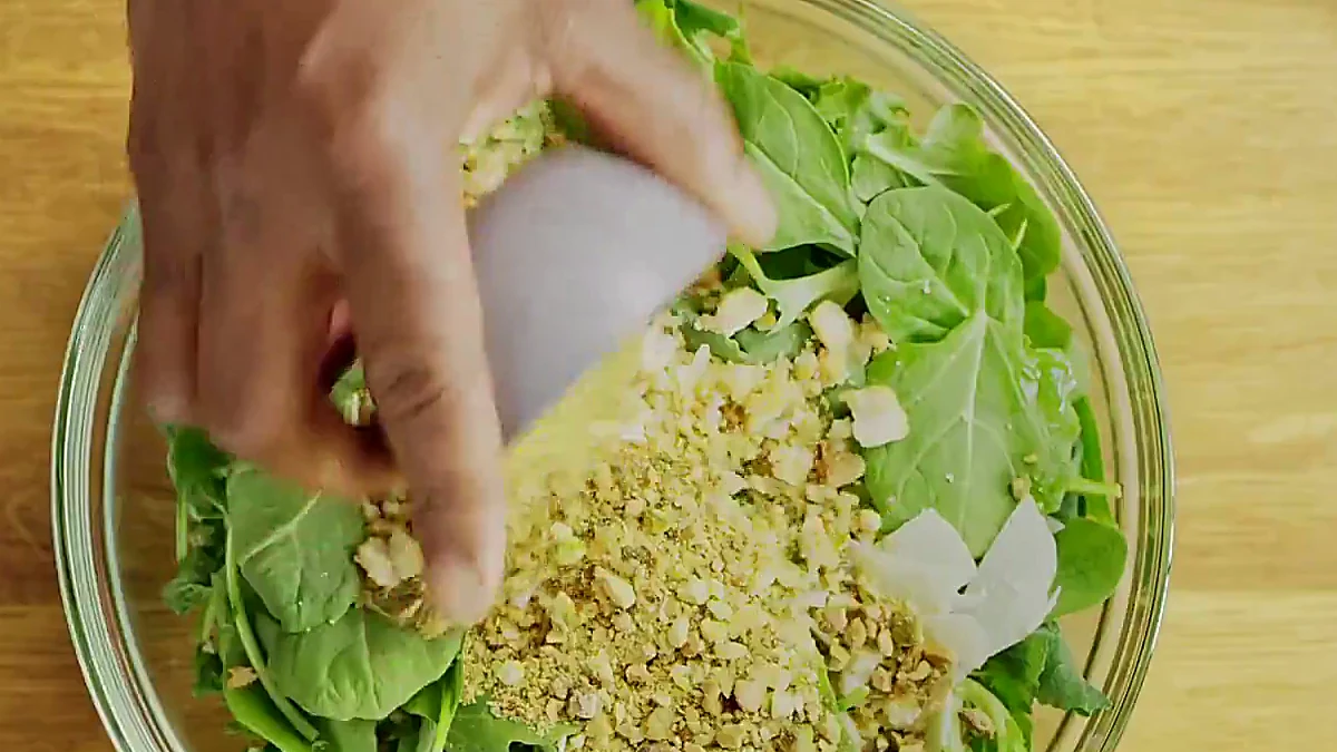 Pistachios and croutons added to kale salad