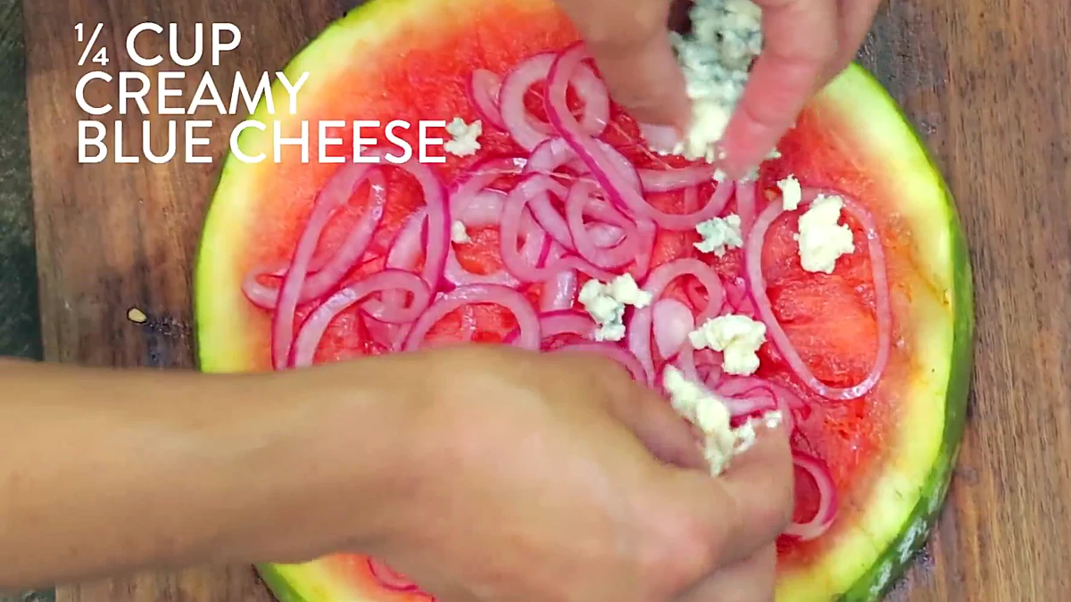 Blue cheese crumbled over watermelon pizza
