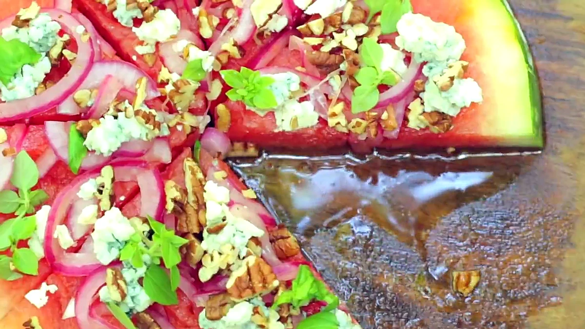 Grilled watermelon pizza sliced into wedges