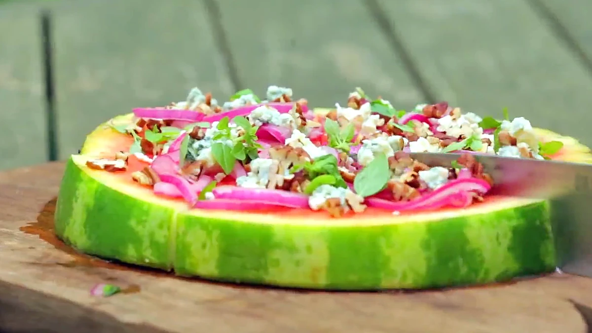 Finished grilled watermelon pizza on a board