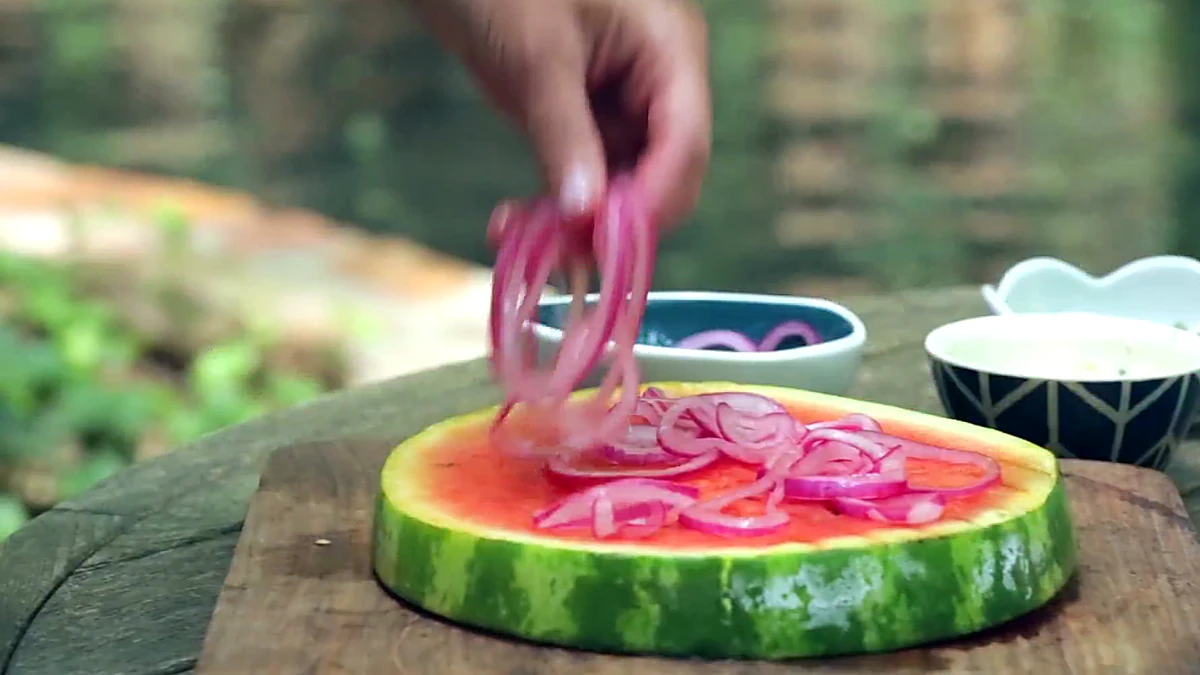 Pickled onions added to grilled watermelon