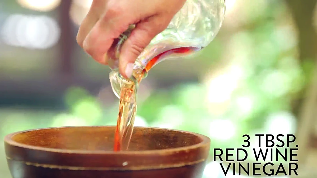 Red wine vinegar added to a bowl