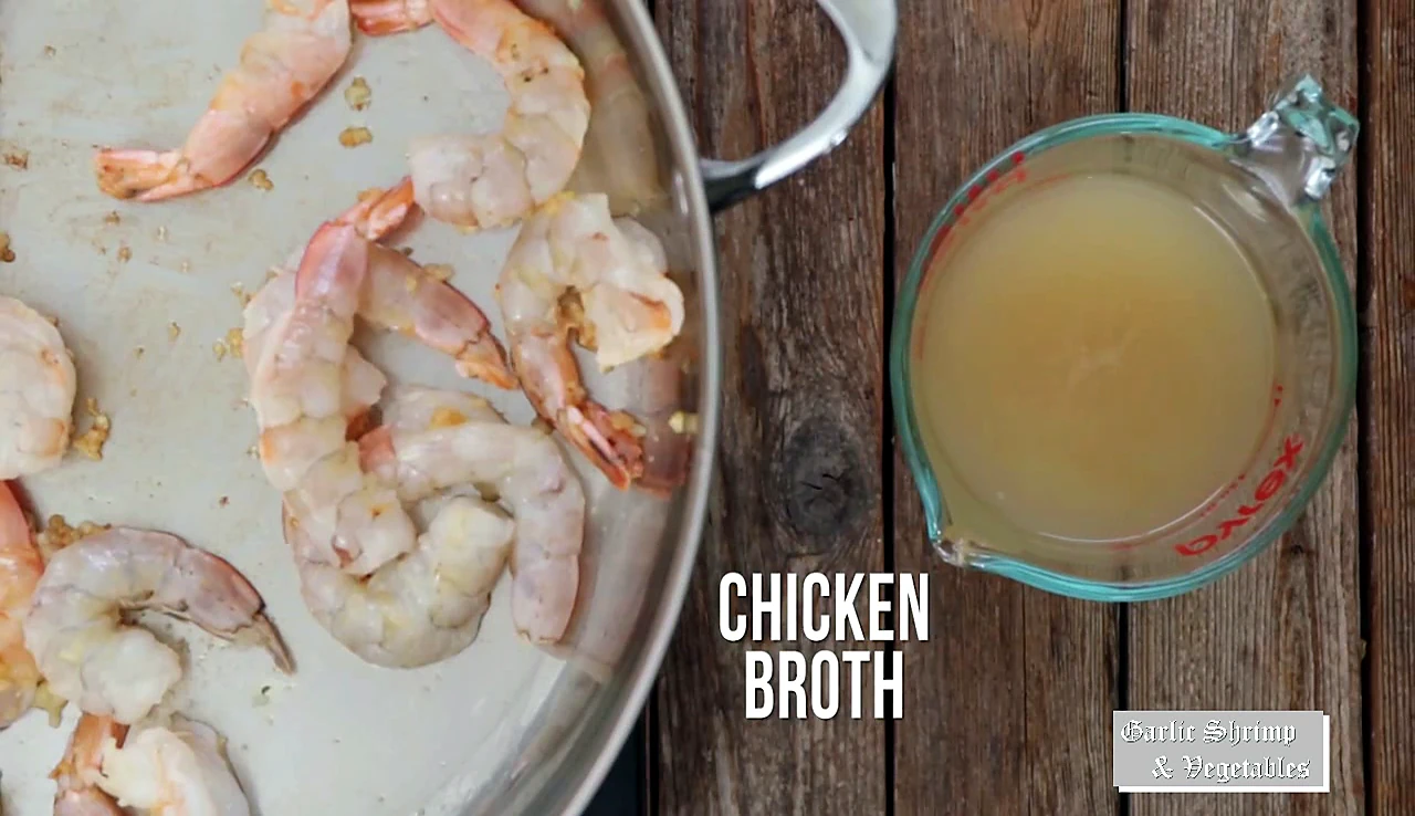 Chicken broth ready beside the shrimp