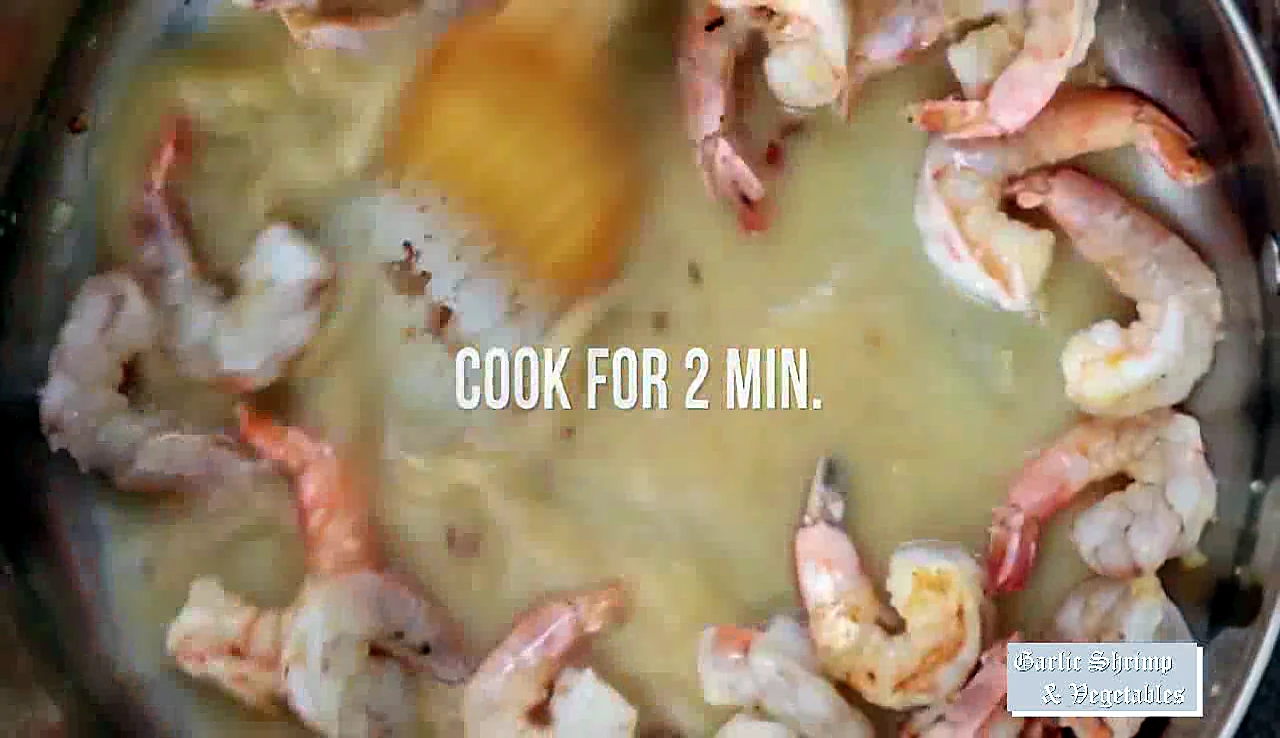 Shrimp cooking in sauce for two minutes