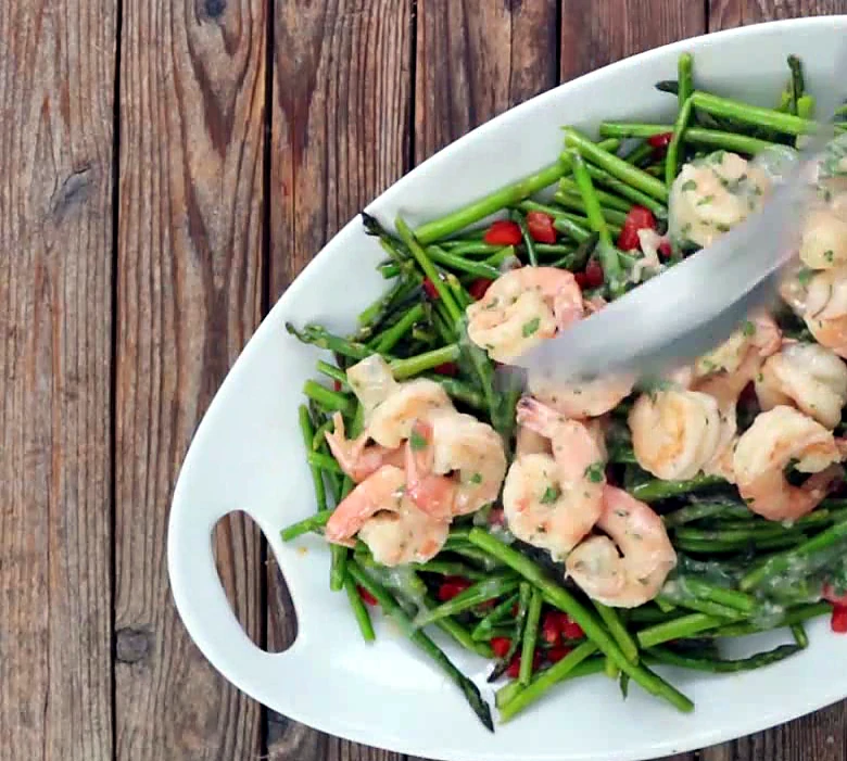 Close platter of lemon garlic shrimp and vegetables