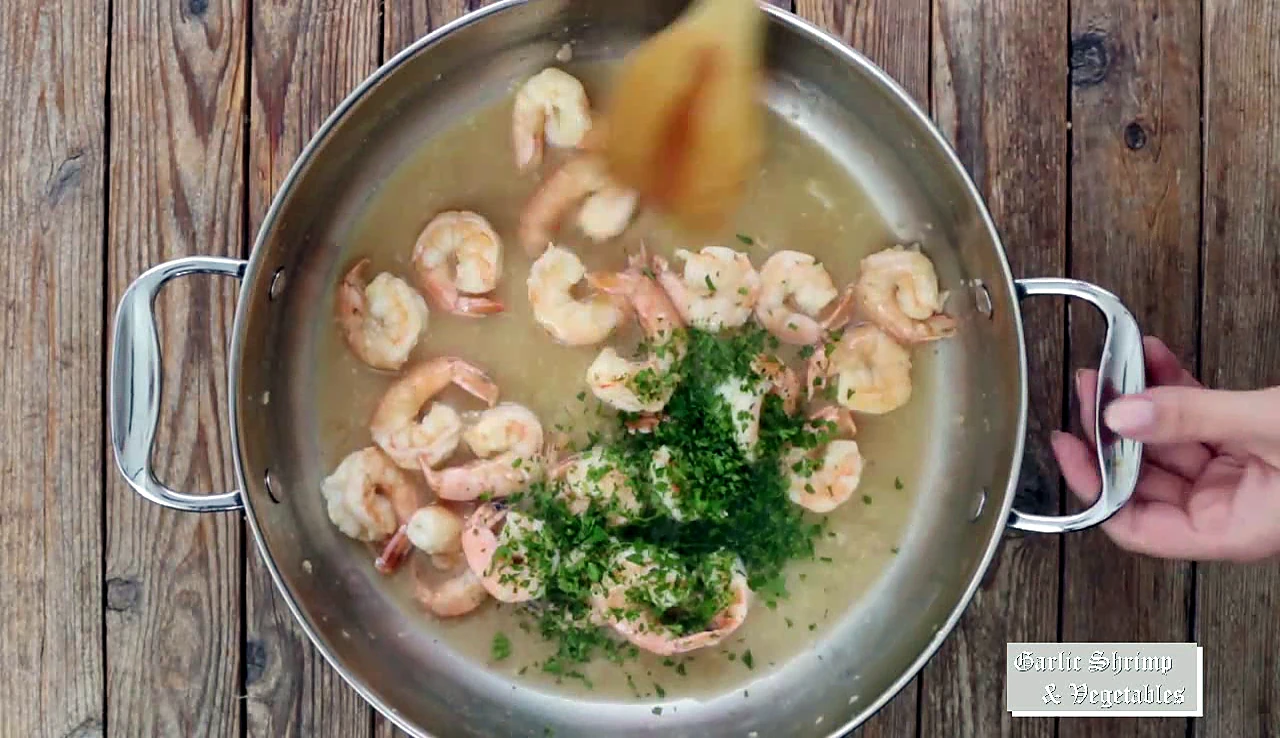 Parsley added to lemon garlic shrimp