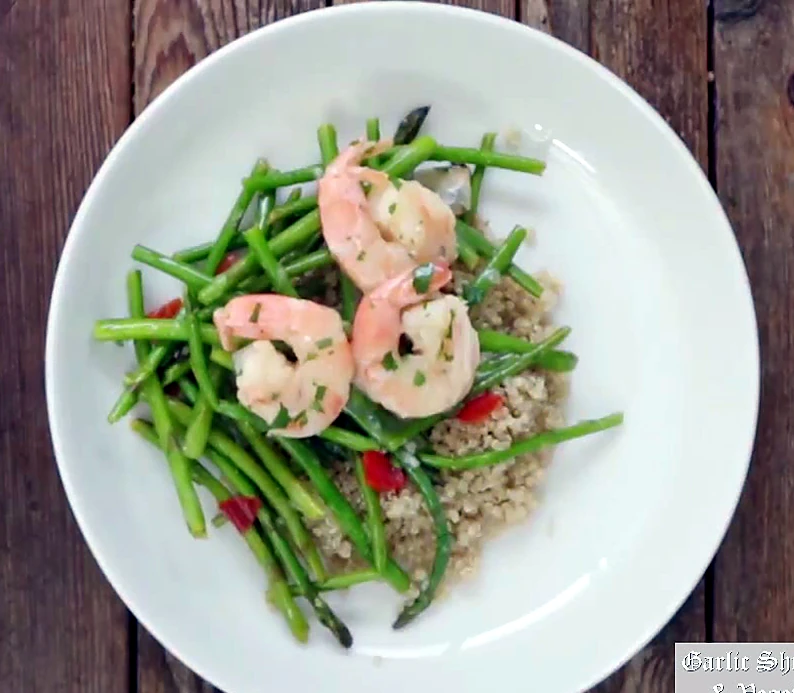 Garlic shrimp and vegetables plated over rice