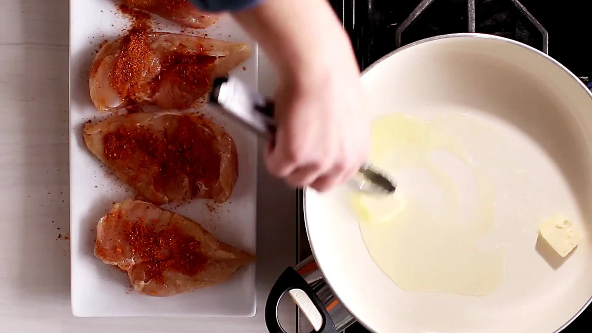 Butter melting in a skillet for lime chicken