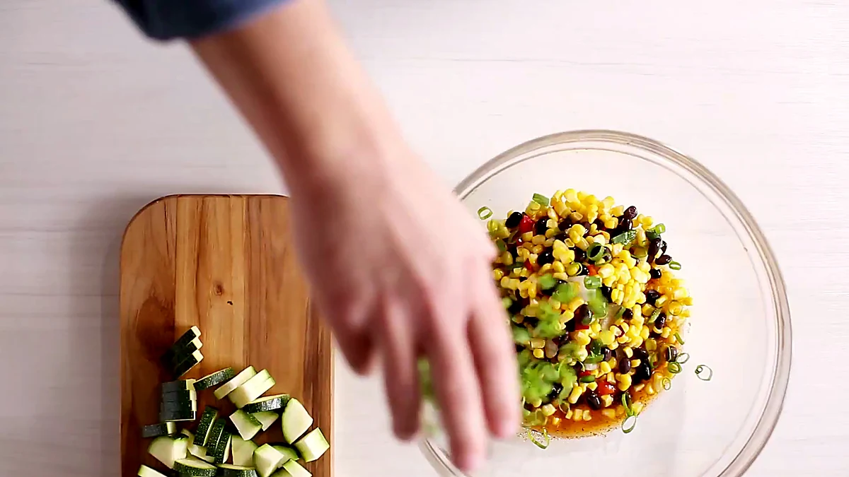 Corn and black bean vegetable blend added to the dressing