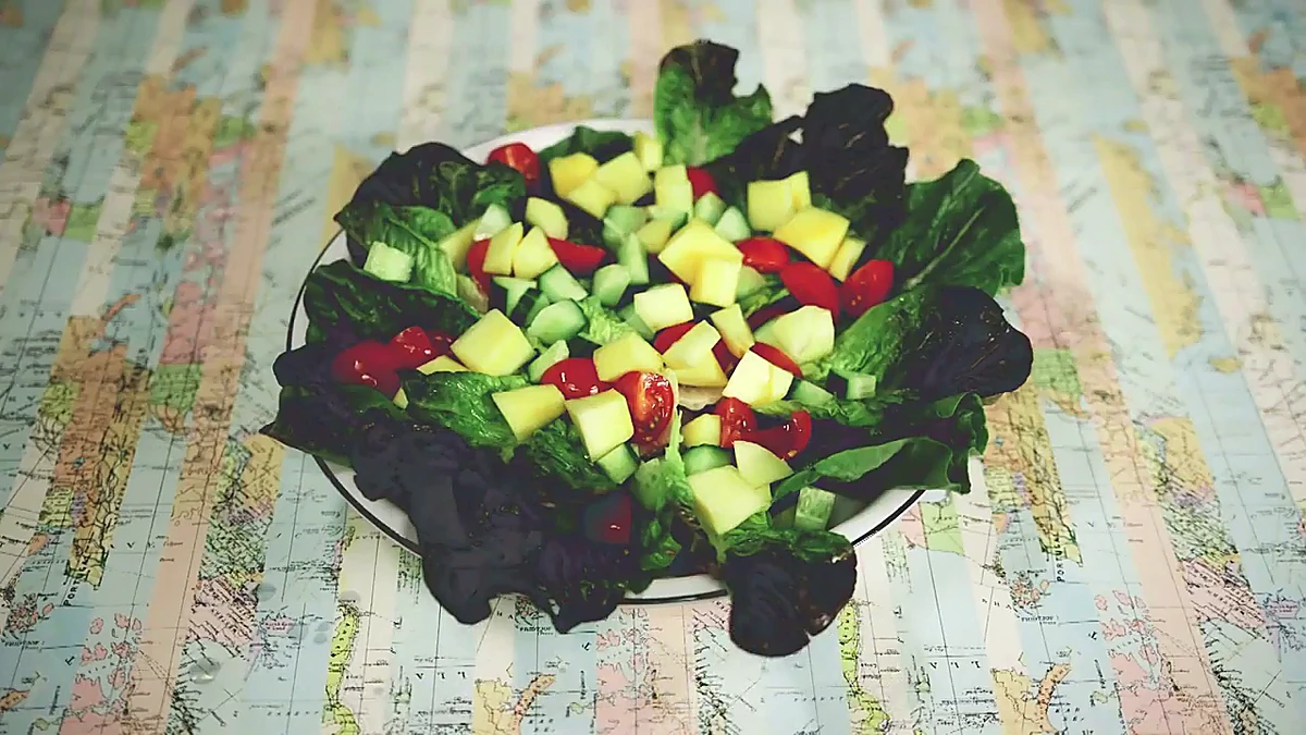 Diced mango scattered over the salad