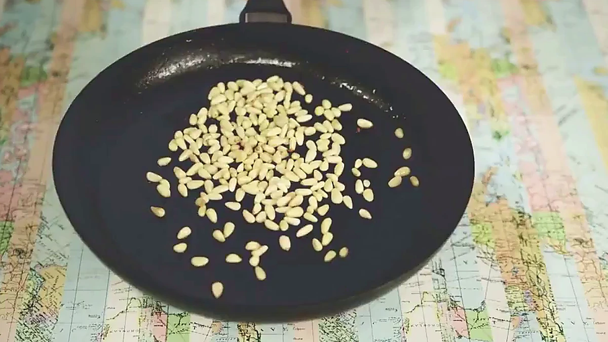 Pine nuts toasting in pancetta oil