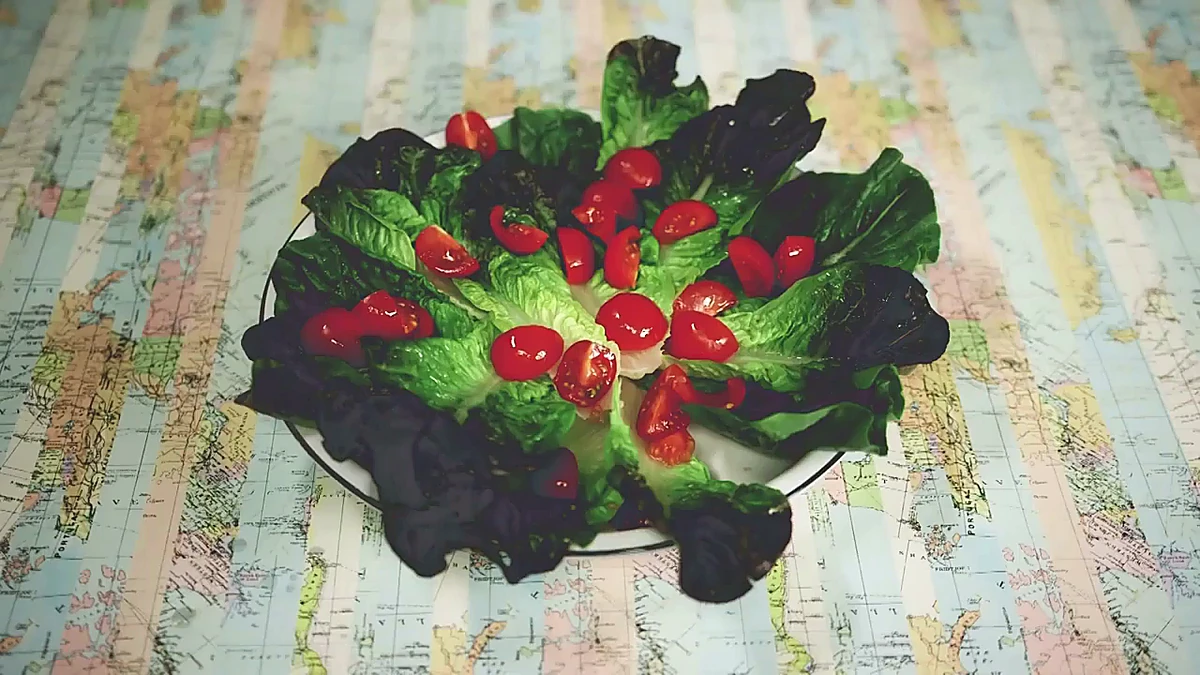 Chopped tomato added to lettuce
