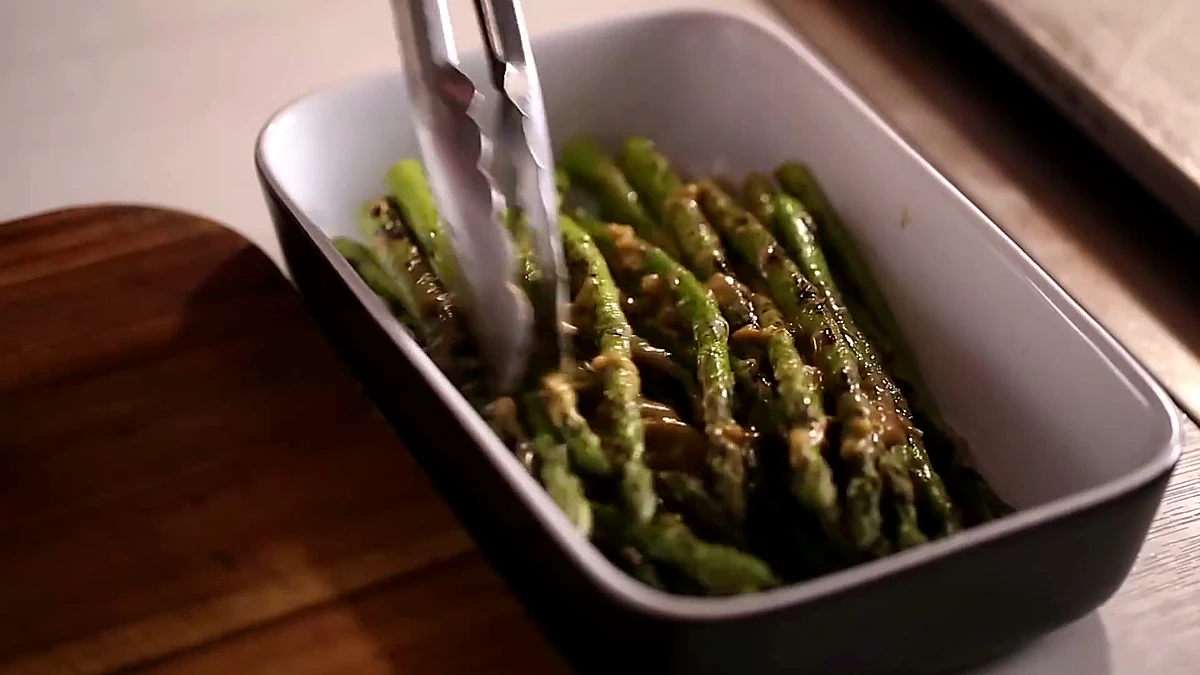 Grilled asparagus tossed with sauce