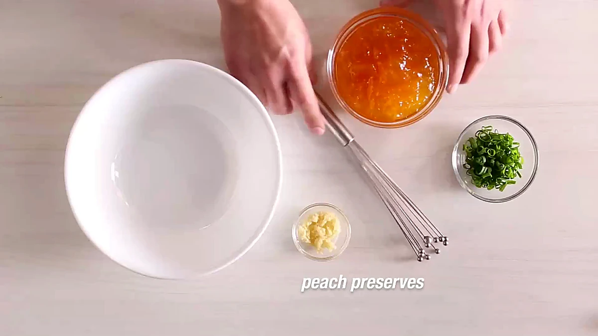 Peach glaze ingredients arranged beside a mixing bowl
