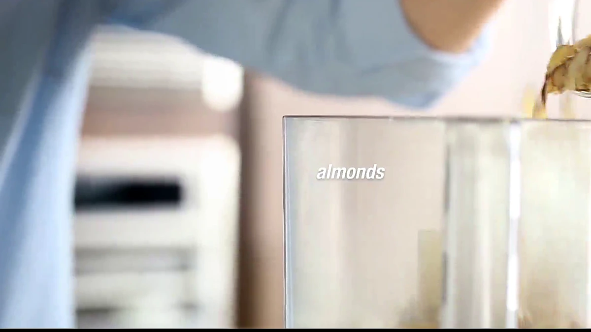 Sliced almonds added to a food processor