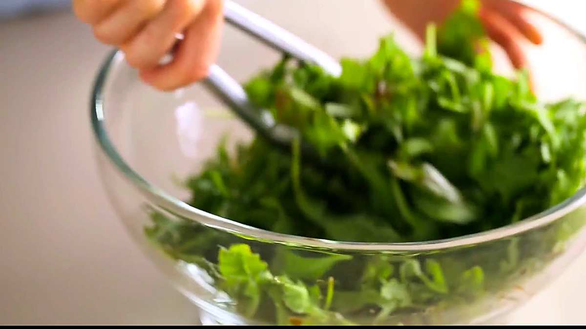 Baby arugula tossed with balsamic vinaigrette