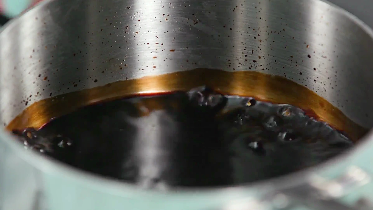 Balsamic vinegar simmering in a pan