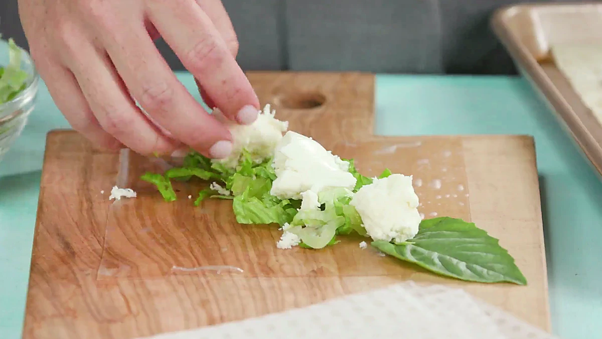 Mozzarella added to a rice paper wrapper