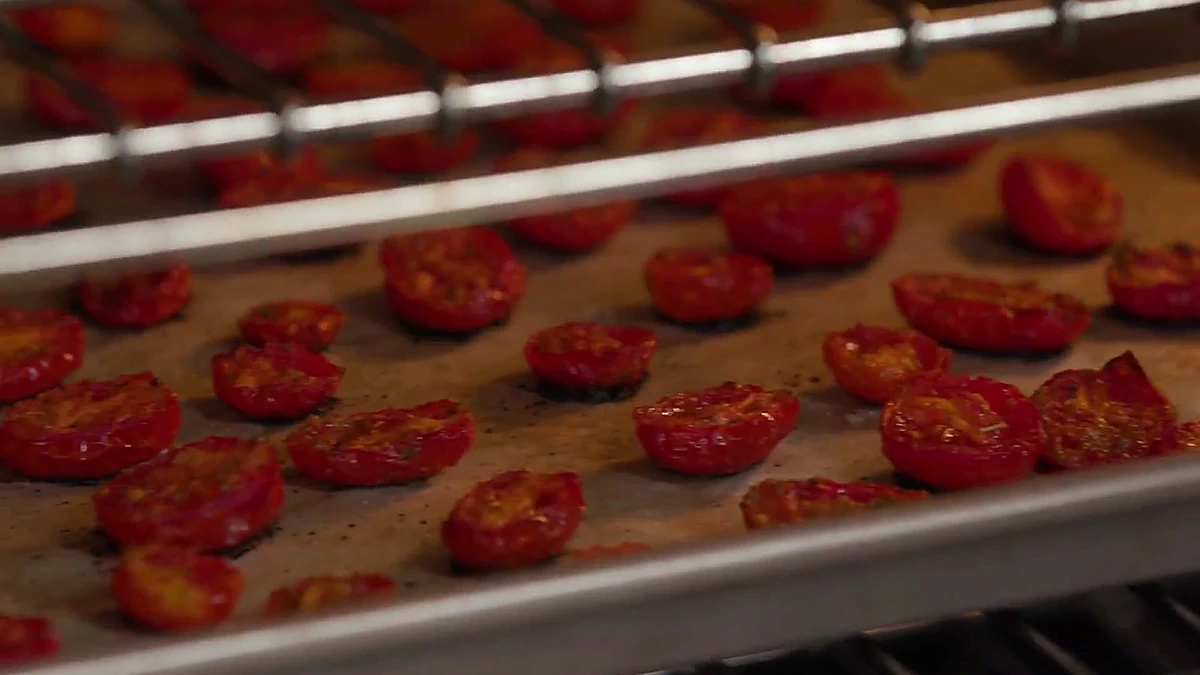 Roasted grape tomatoes on a sheet pan