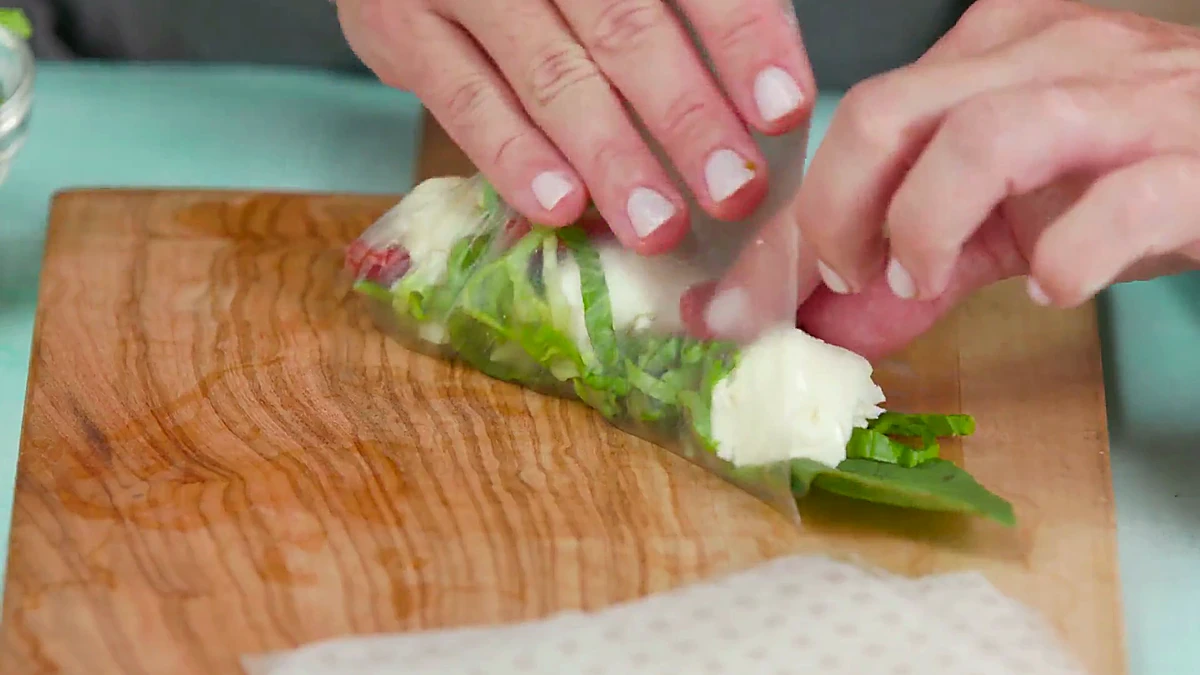 Rice paper wrapper folded over Caprese filling