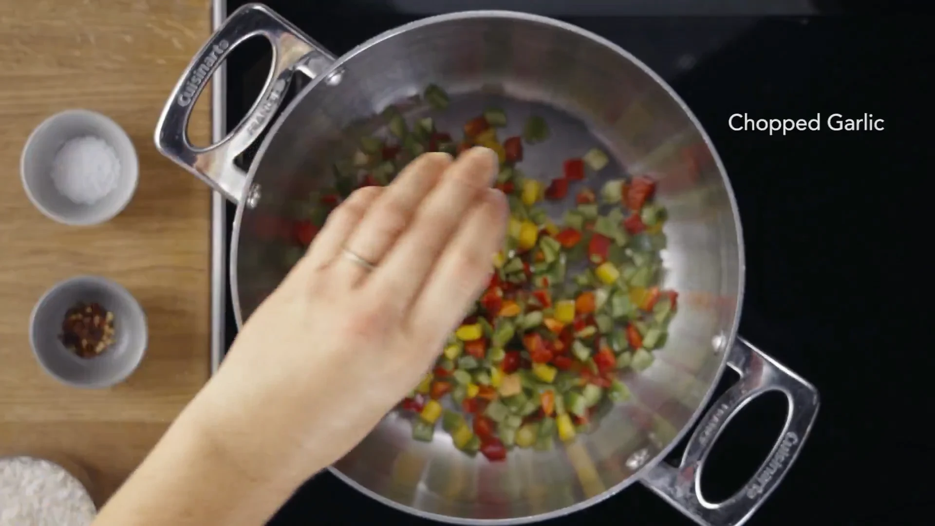 Chopped garlic added to the pot with peppers