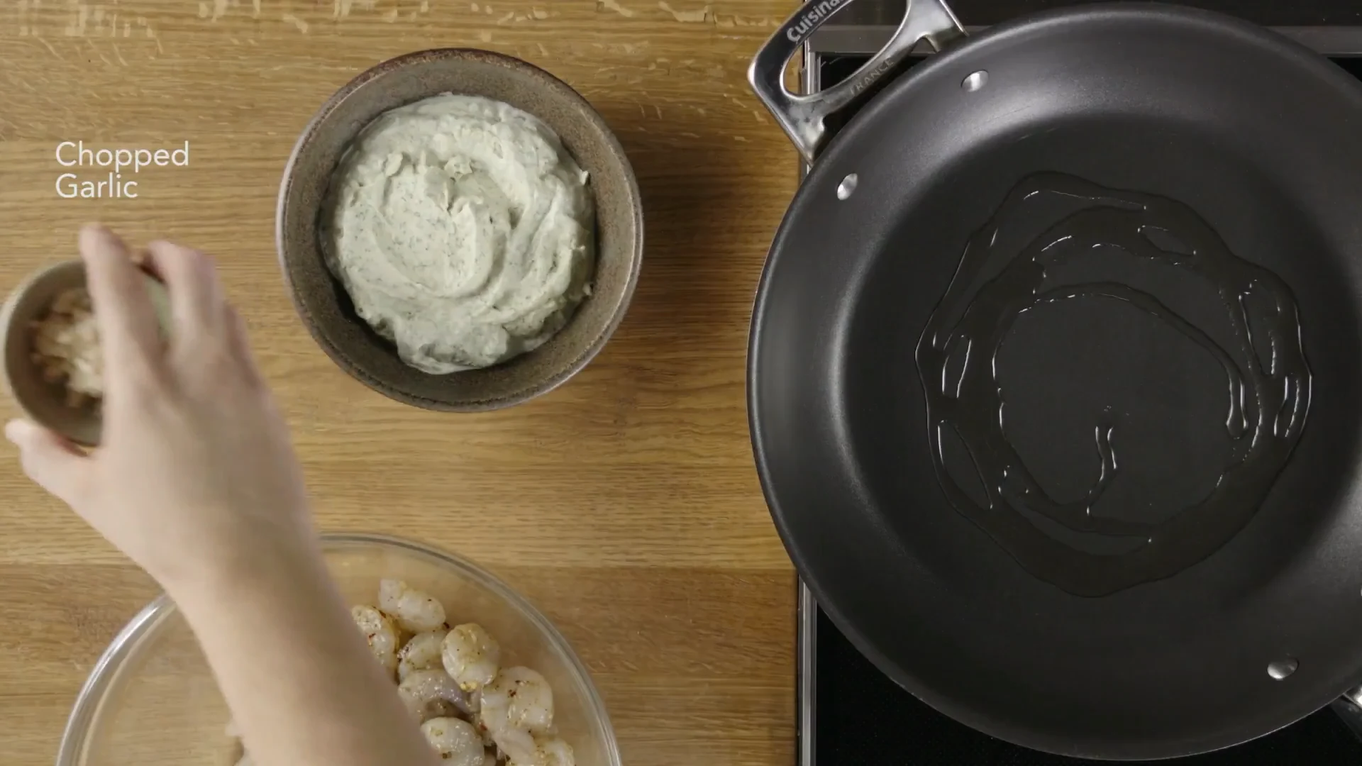 Chopped garlic and oil in a hot skillet ready for shrimp