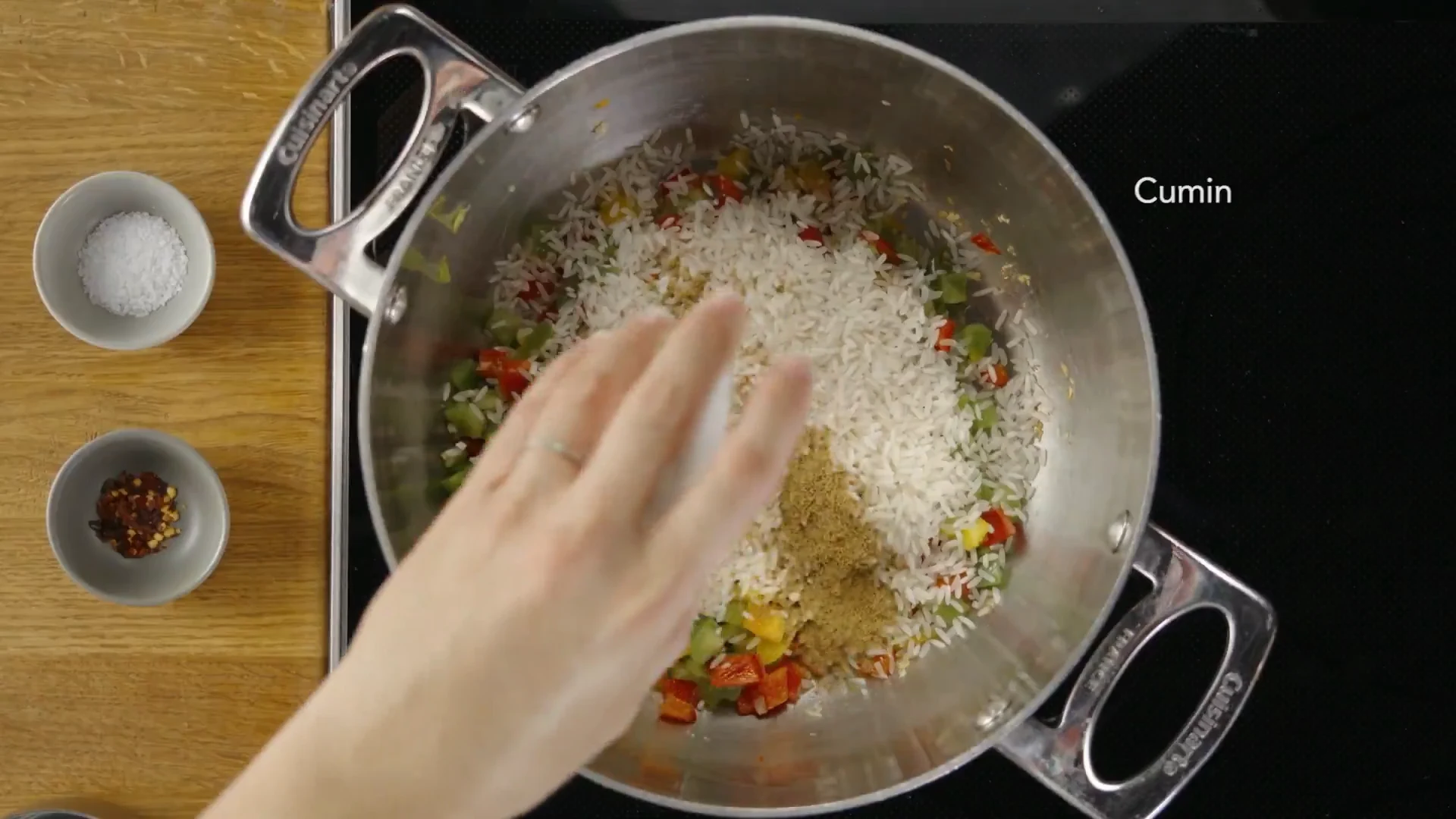 Cumin sprinkled over the seasoned rice