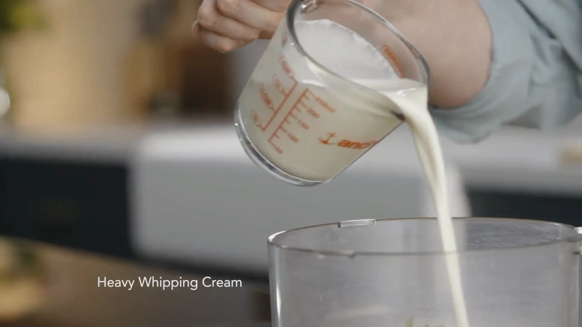 Heavy whipping cream poured into the processor