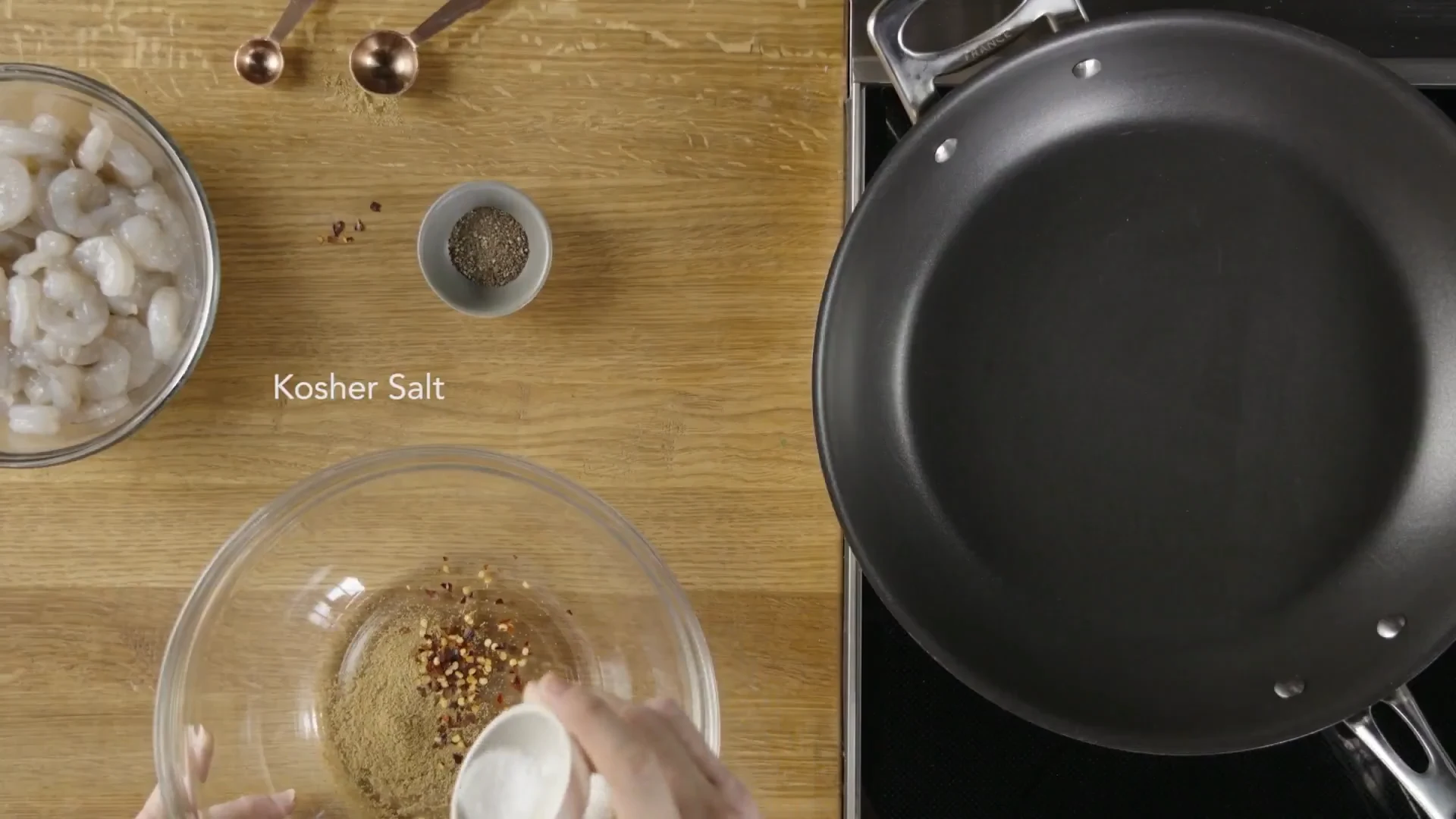 Kosher salt added to the shrimp seasoning