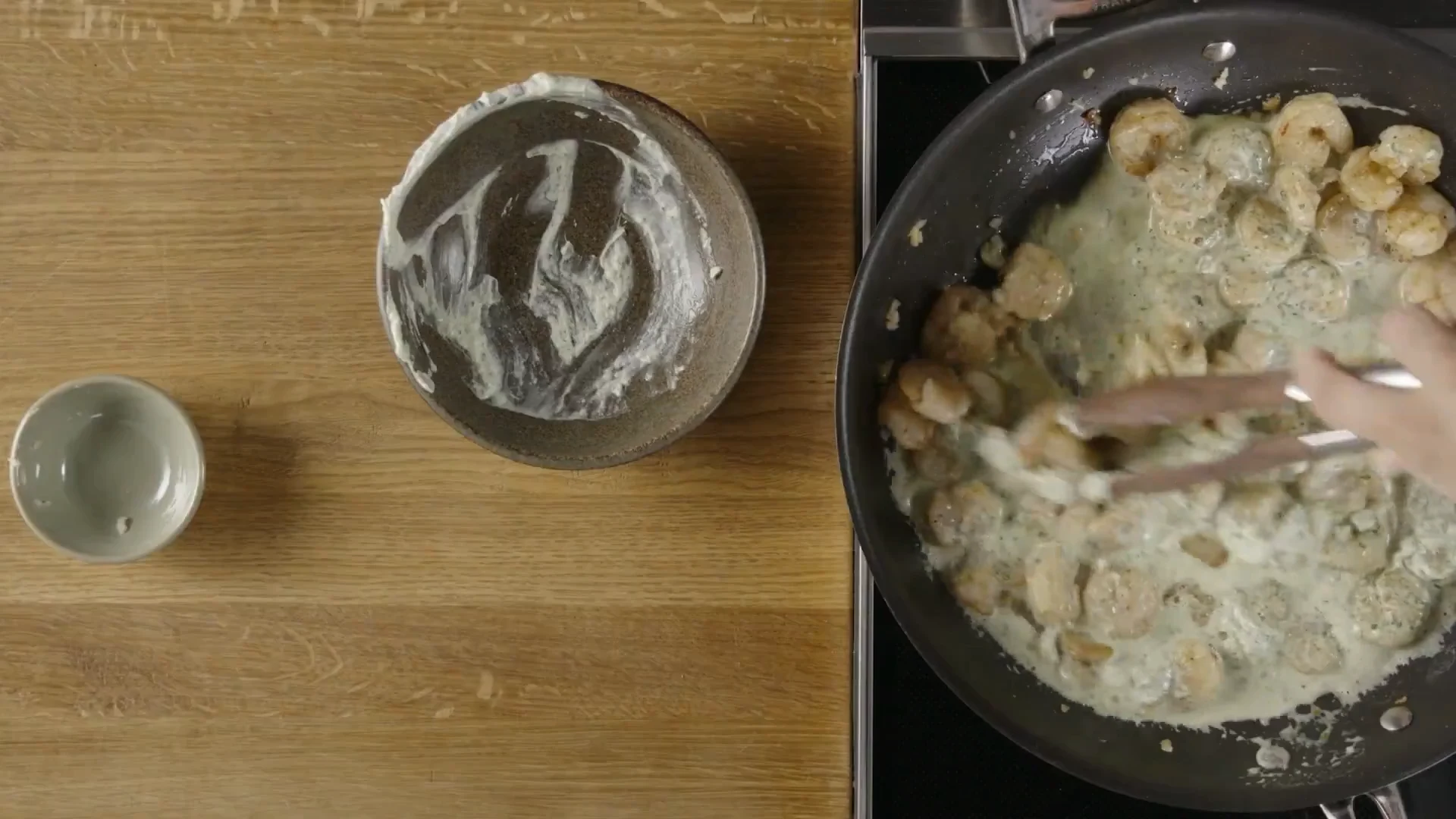 Shrimp simmering in pale green verde cream sauce