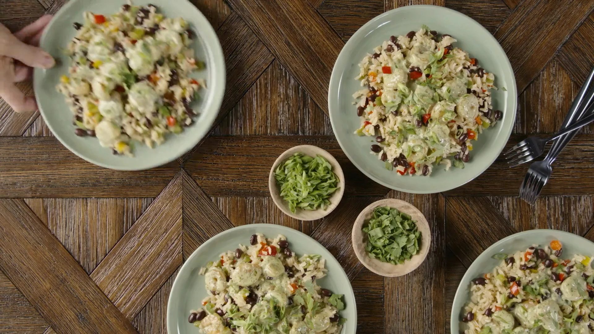 Overhead spread of shrimp verde with spiced rice plates