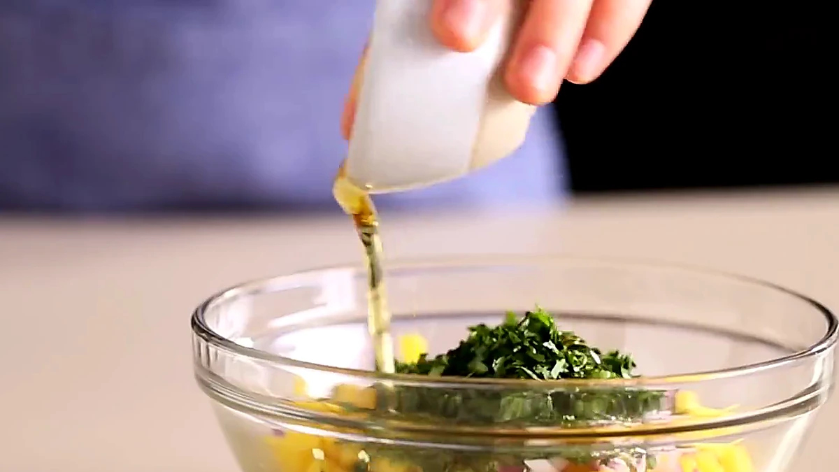 Agave nectar poured into mango salsa