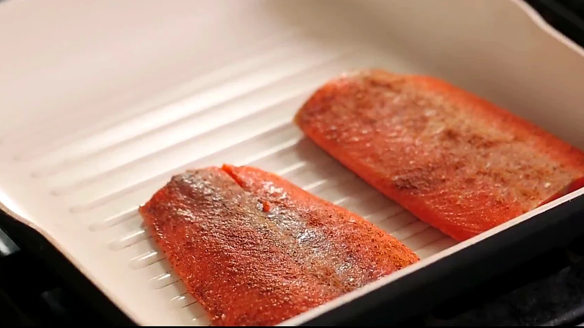 Salmon fillets placed in a grill pan