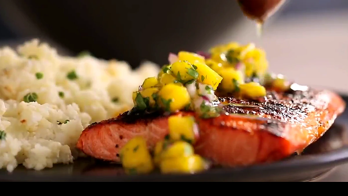 Close view of mango salsa on spiced salmon